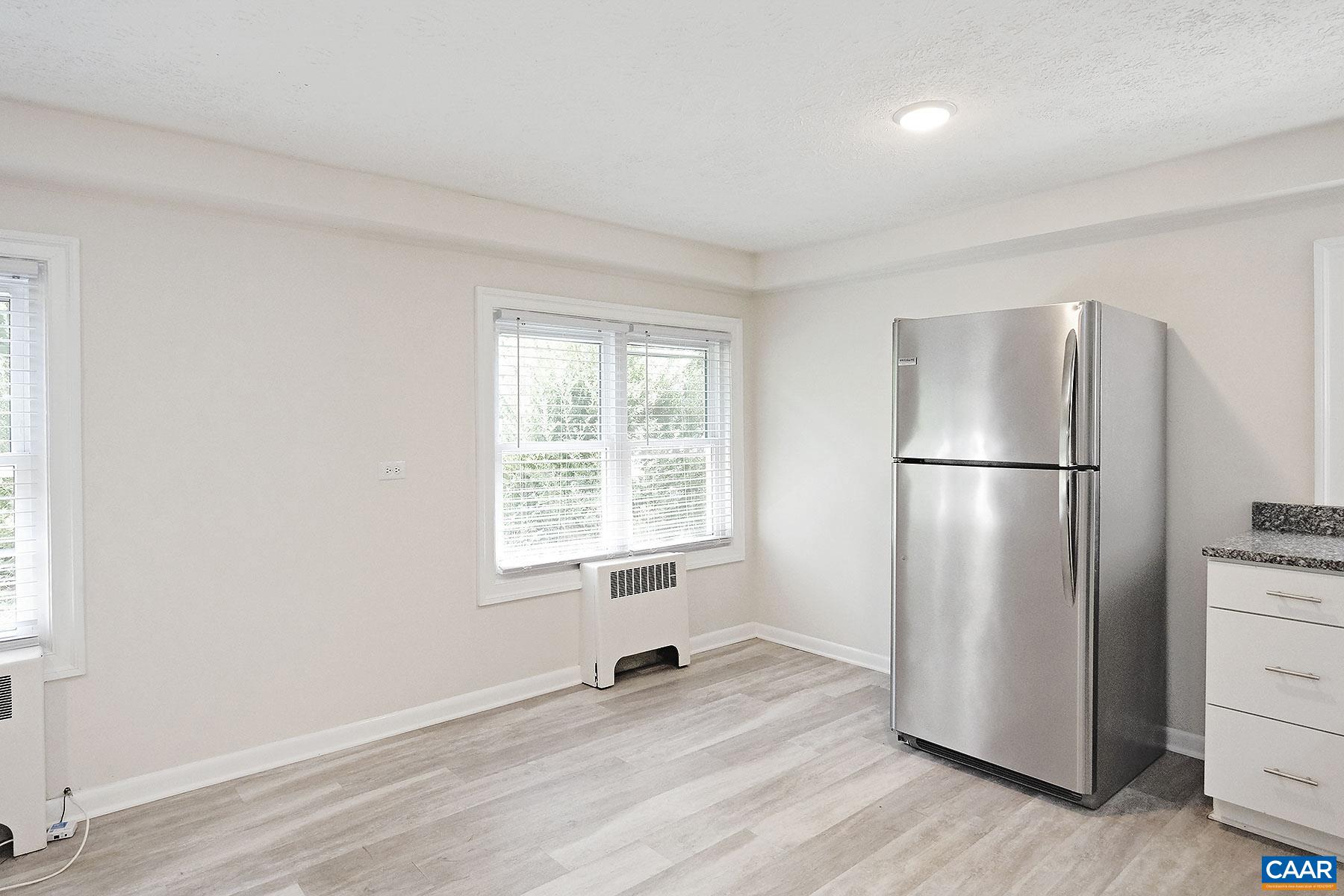 616 Rockcreek Road, Unit B Charlottesville, VA 22903 - Photo 5 of 13 a view of a refrigerator in kitchen and a window