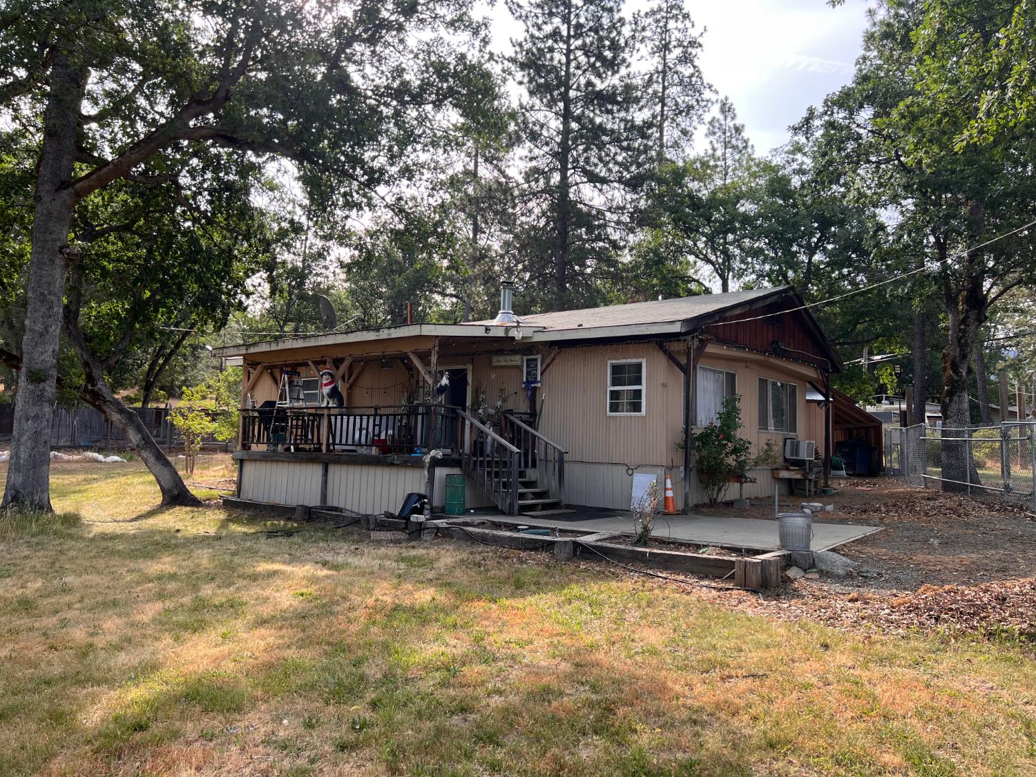 70 Oak Avenue Hayfork, CA 96041 - Photo 2 of 49 a house with trees in the background