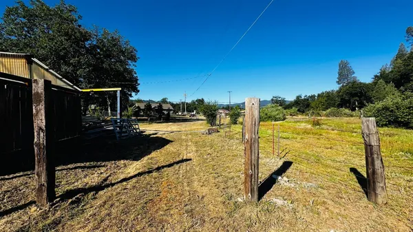 a view of a backyard of the house