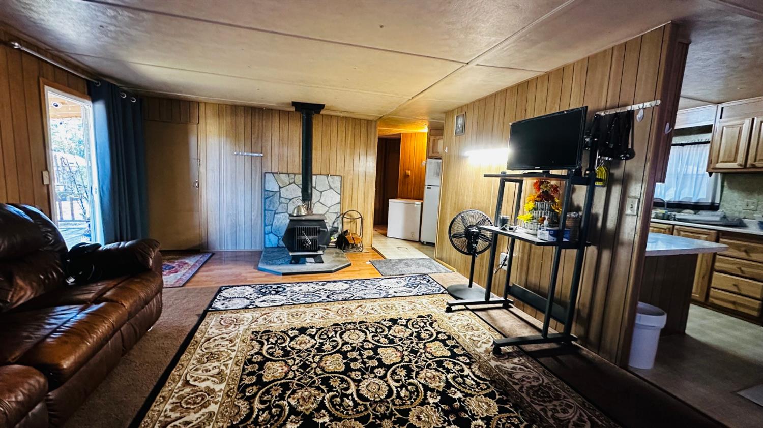 70 Oak Avenue Hayfork, CA 96041 - Photo 32 of 49 a living room with furniture fireplace and flat screen tv