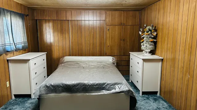 a kitchen with sink refrigerator and cabinets