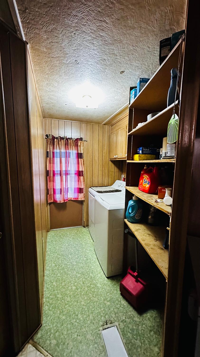 70 Oak Avenue Hayfork, CA 96041 - Photo 49 of 49 a utility room with dryer washer and a view of living room