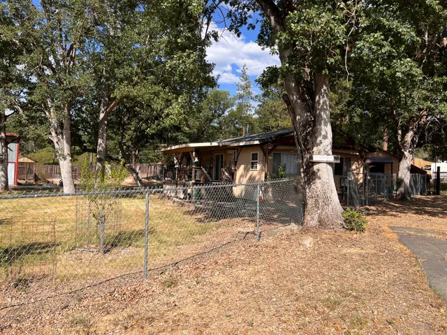 a view of a house with snow on the road