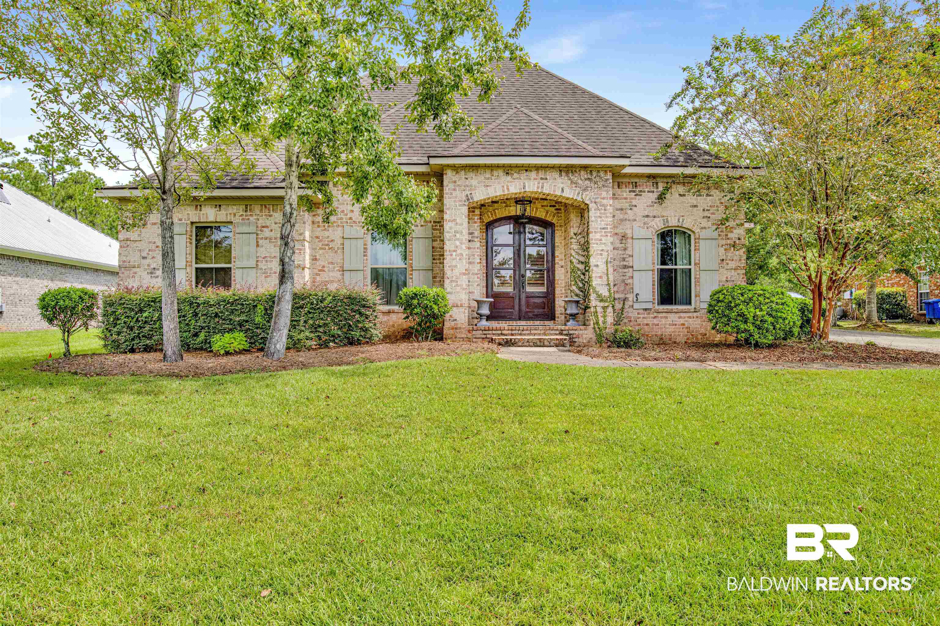 9240 Bay Point Drive Elberta, AL 36530 - Photo 1 of 22 French provincial home featuring french doors and a front lawn
