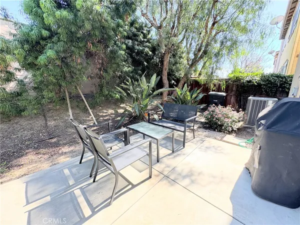 a view of a backyard with sitting area