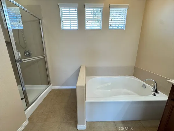 a white bath tub sitting next to a window