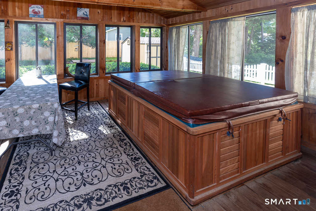 428 Hammock Road Westbrook, CT 06498 - Photo 14 of 40 Three season sun porch with hot tub