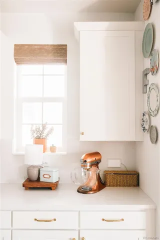 a bathroom with a sink and a window