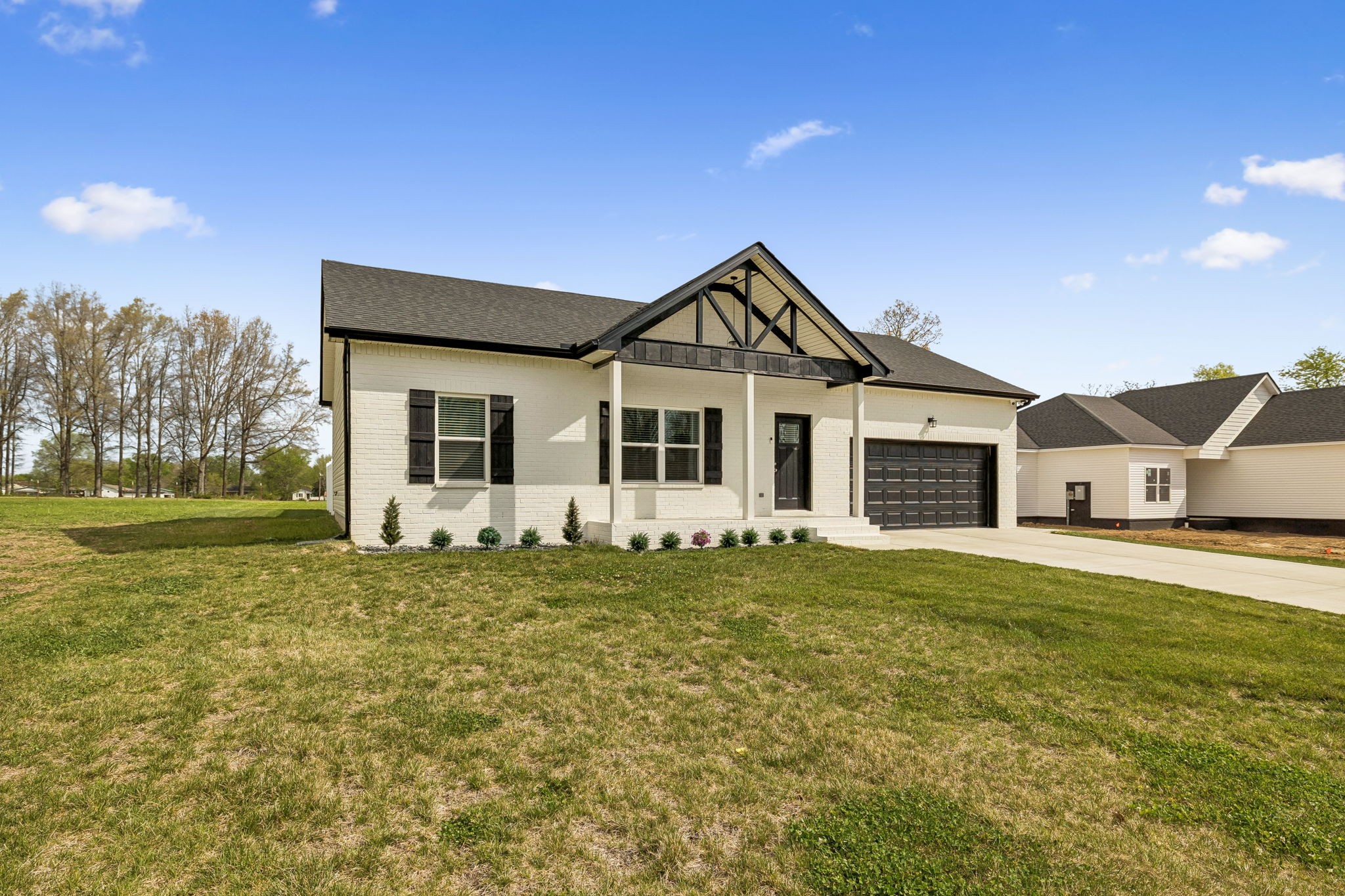 180 Vickers Hill Road Smithville, TN 37166 - Photo 4 of 33 a front view of a house with a garden
