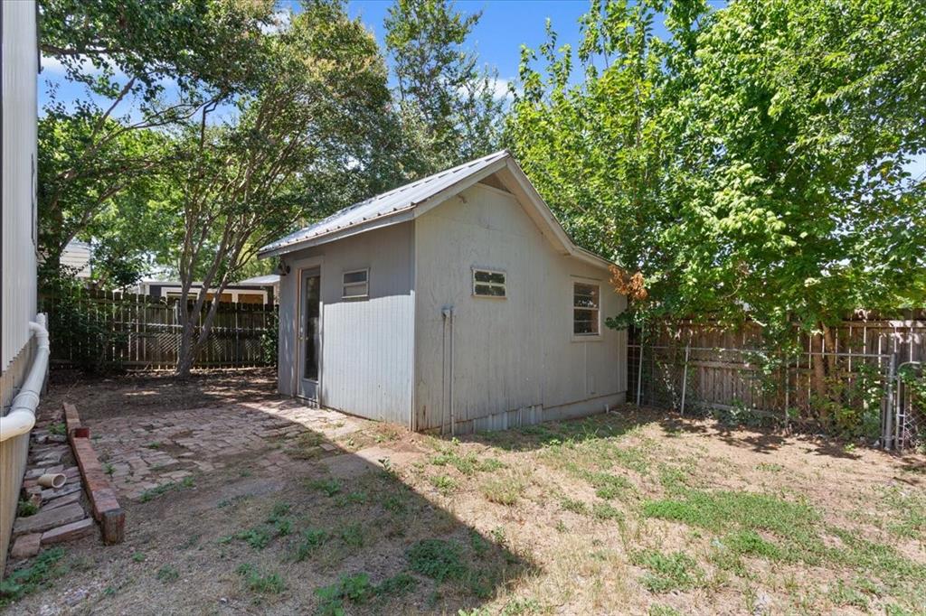 108 Private Road Whitney, TX 76692 - Photo 31 of 36 Shed #1.Detached storage shed featuring a metal roof and side window