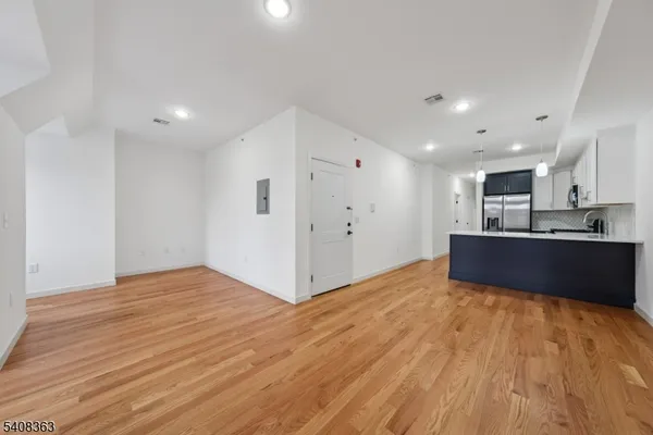 a view of kitchen with wooden floor