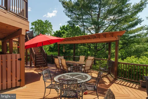 a view of backyard with swimming pool