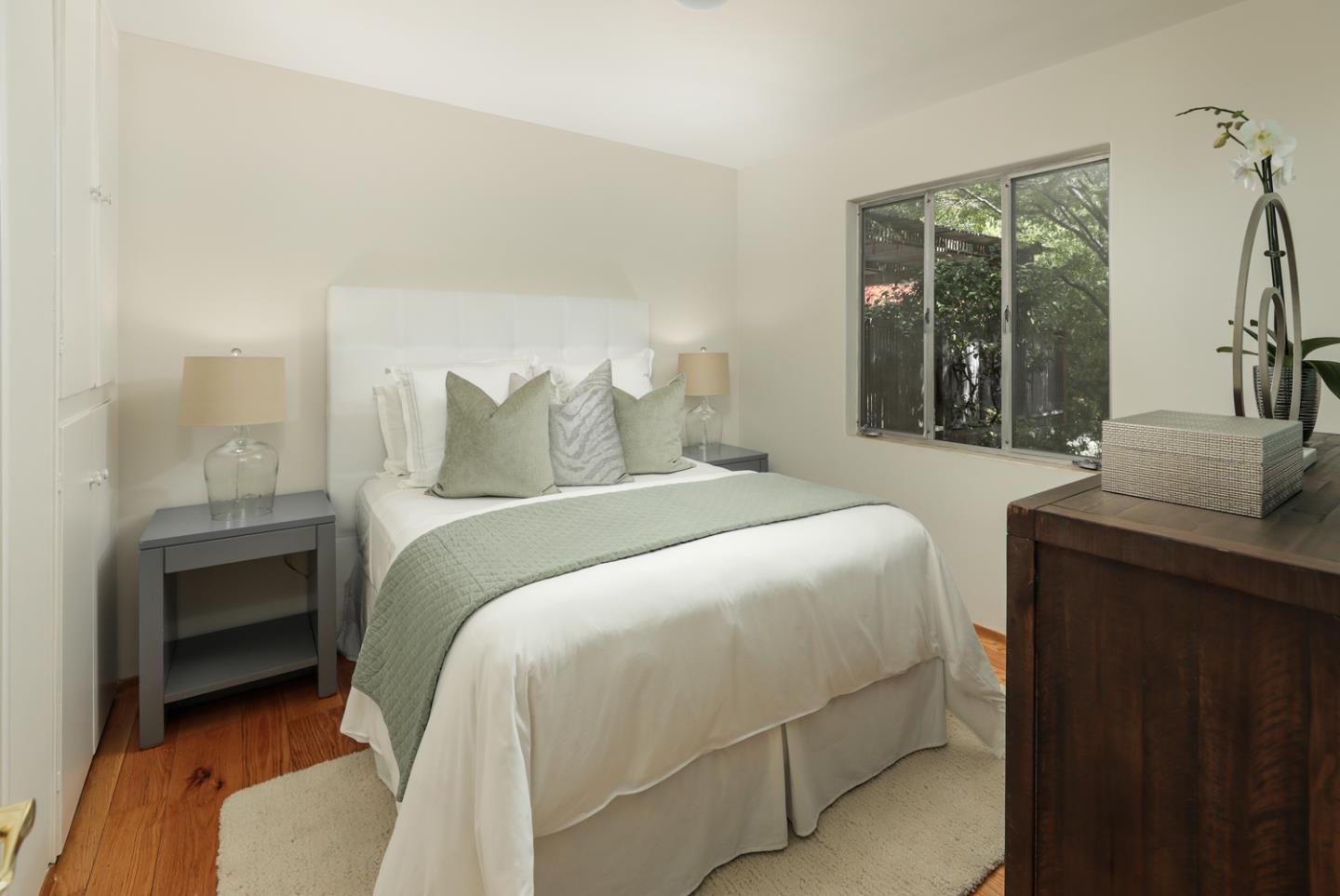 1869 Appletree Lane Mountain View, CA 94040 - Photo 16 of 35 a bedroom with a bed and a window