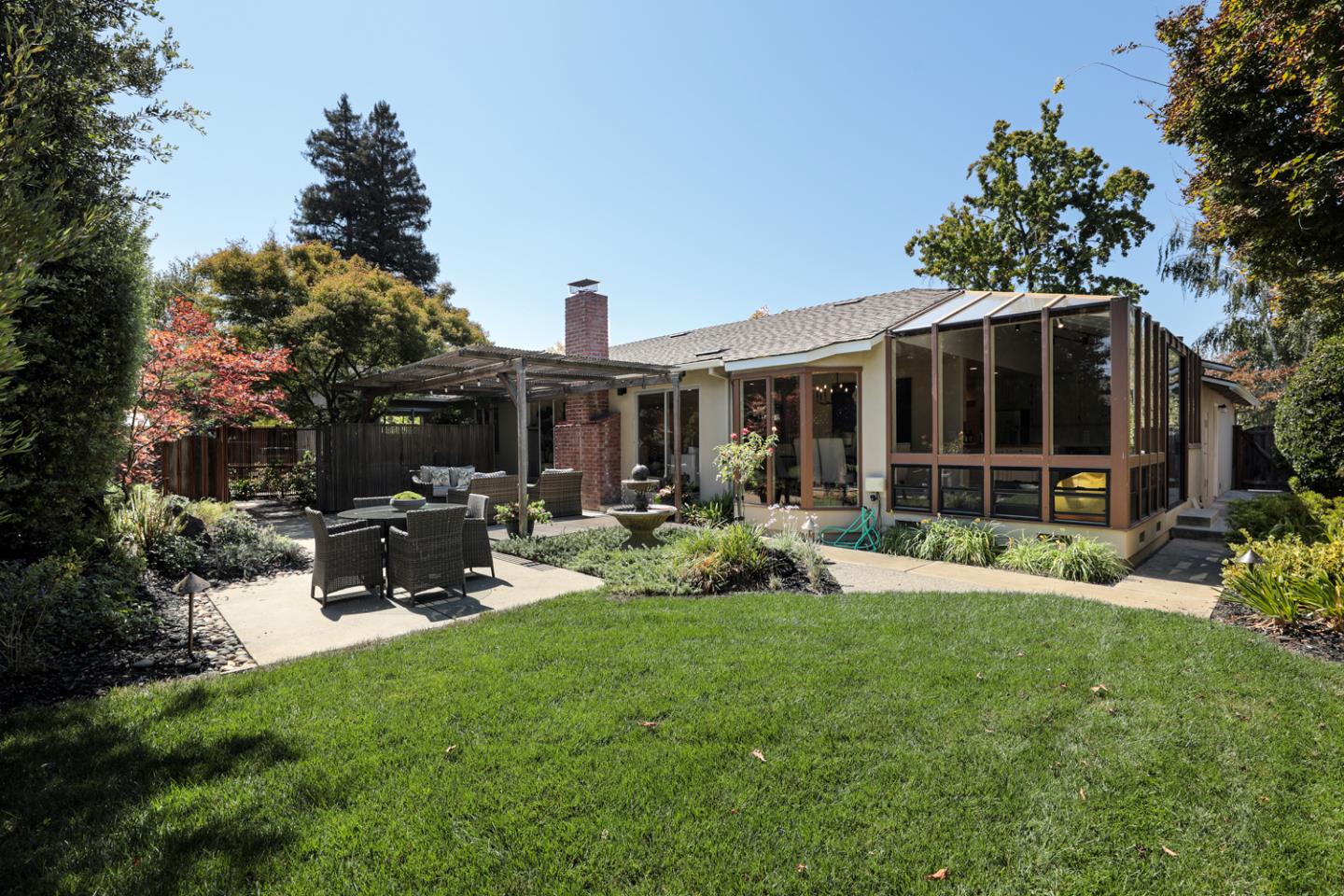 1869 Appletree Lane Mountain View, CA 94040 - Photo 26 of 35 a view of a house with backyard porch and sitting area