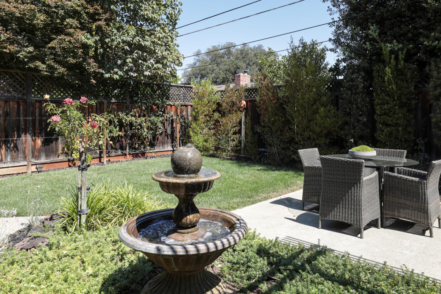 1869 Appletree Lane Mountain View, CA 94040 - Photo 29 of 35 a view of a garden with a fountain in the patio