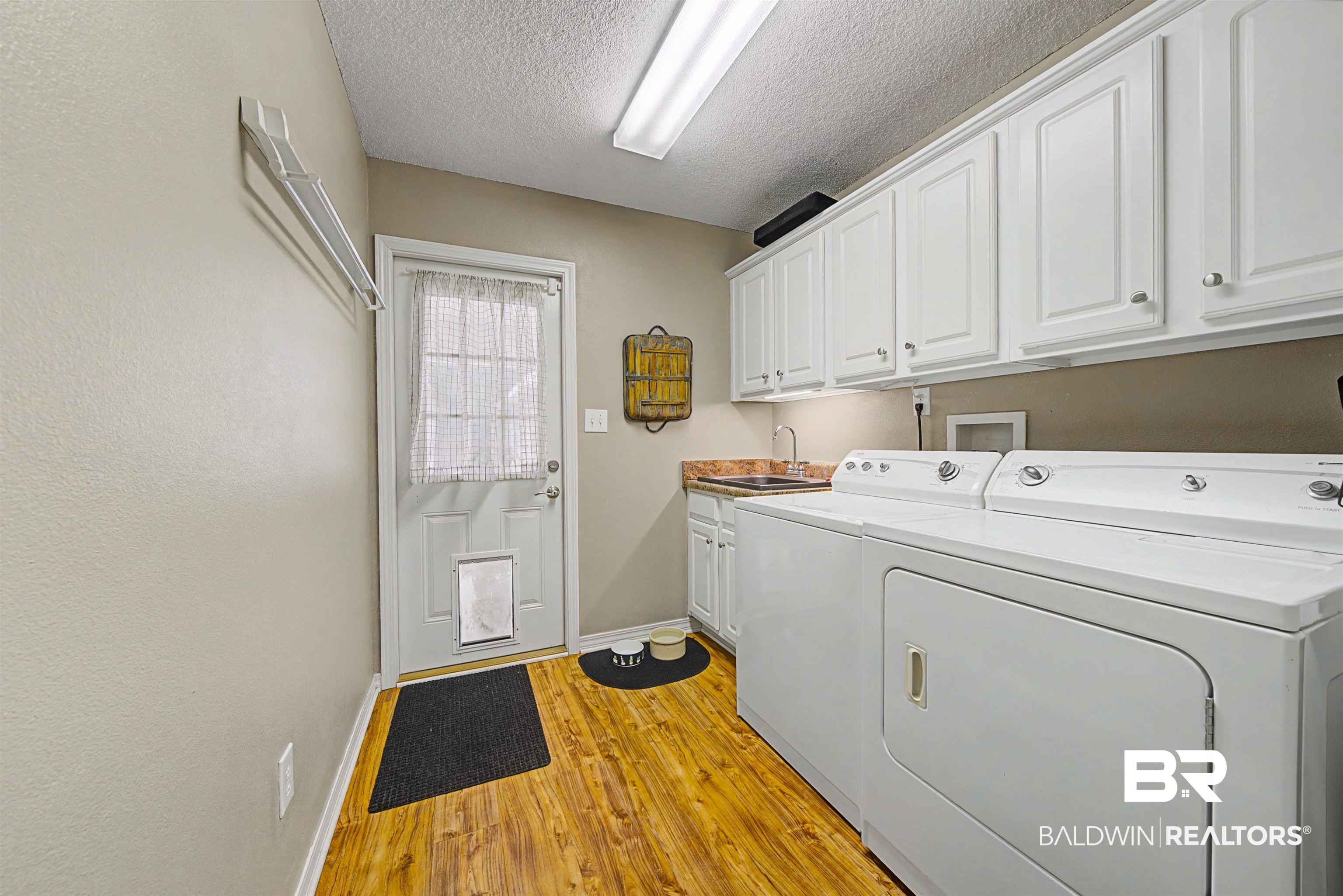 313 Collinwood Loop Foley, AL 36535 - Photo 16 of 36 Laundry room with light flooring.