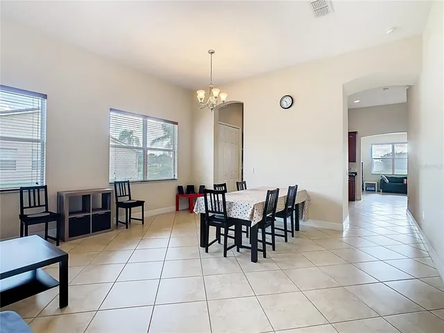 a kitchen with stainless steel appliances granite countertop a refrigerator sink and stove