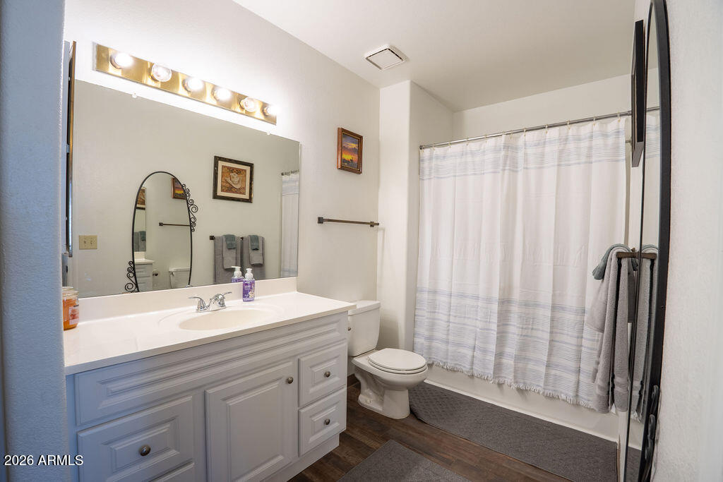 1825 West Ray Road, Unit 2120 Chandler, AZ 85224 - Photo 13 of 26 a bathroom with a sink a toilet and shower