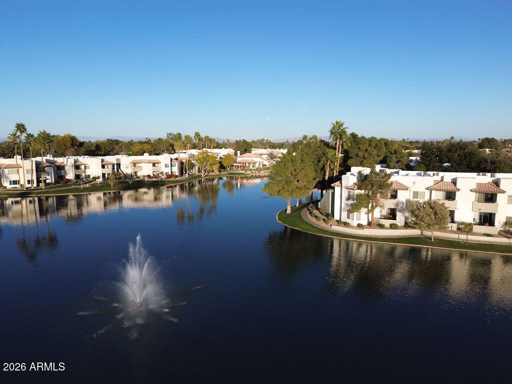 1825 West Ray Road, Unit 2120 Chandler, AZ 85224 - Photo 25 of 26 a view of a lake with houses