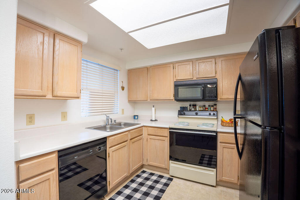 1825 West Ray Road, Unit 2120 Chandler, AZ 85224 - Photo 8 of 26 a kitchen with a sink stove and refrigerator