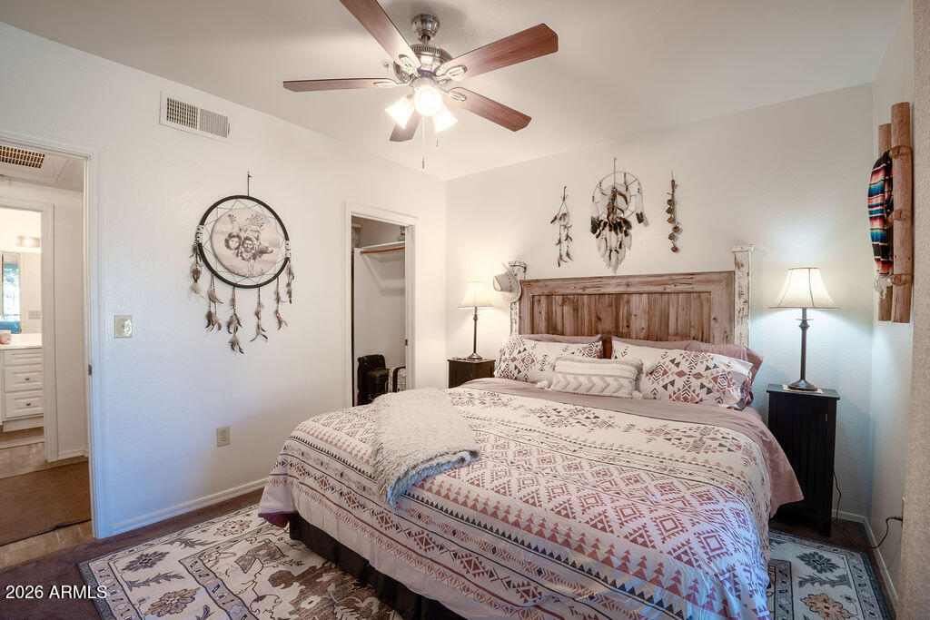 1825 West Ray Road, Unit 2120 Chandler, AZ 85224 - Photo 10 of 26 a bedroom with a large bed and a window