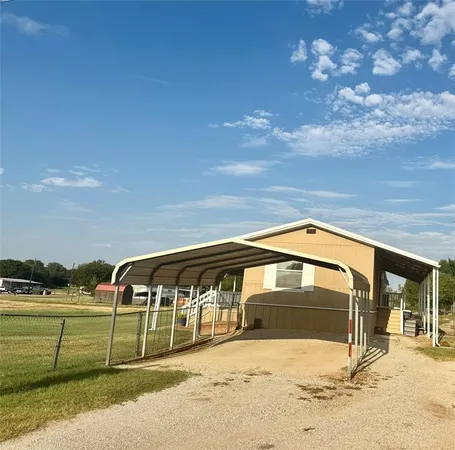 a view of backyard with swimming pool
