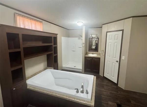 a bathroom with a bathtub and a sink