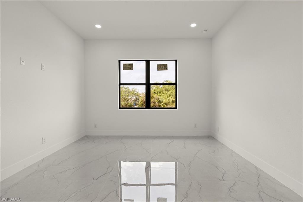 406 West 11th Street Lehigh Acres, FL 33972 - Photo 15 of 24 an empty room with a window