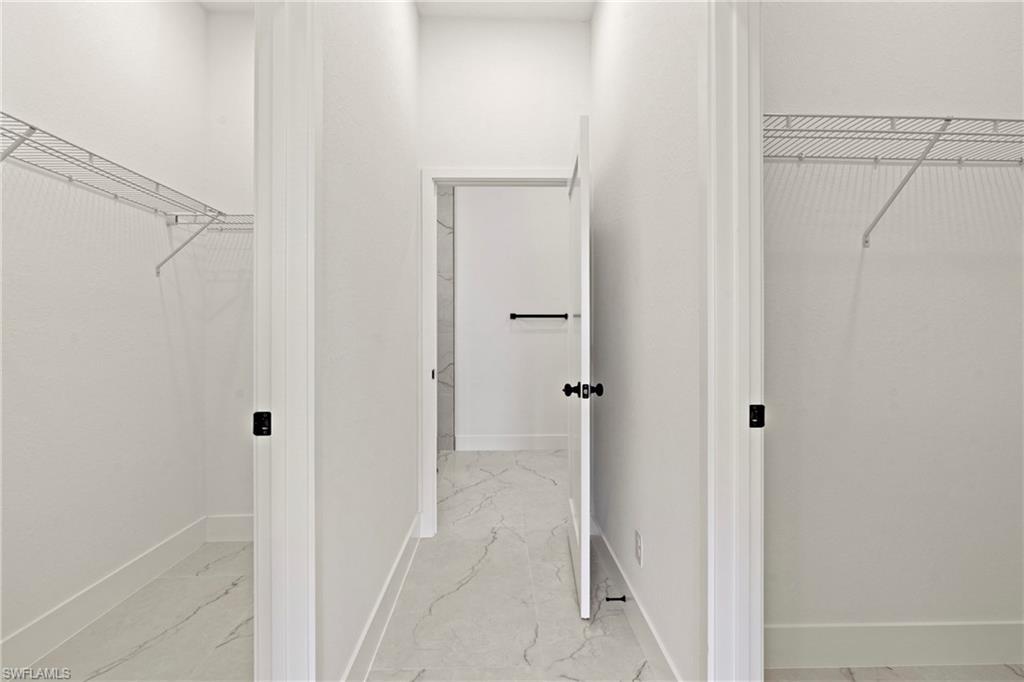 406 West 11th Street Lehigh Acres, FL 33972 - Photo 16 of 24 a view of a bathroom from a white door