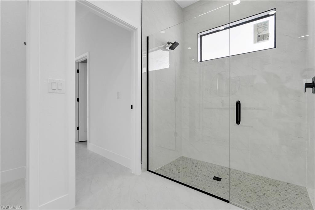 406 West 11th Street Lehigh Acres, FL 33972 - Photo 20 of 24 a bathroom with a shower