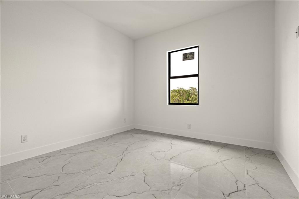 406 West 11th Street Lehigh Acres, FL 33972 - Photo 23 of 24 an empty room with a window