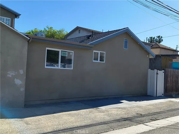 a kitchen with stainless steel appliances a stove sink and microwave
