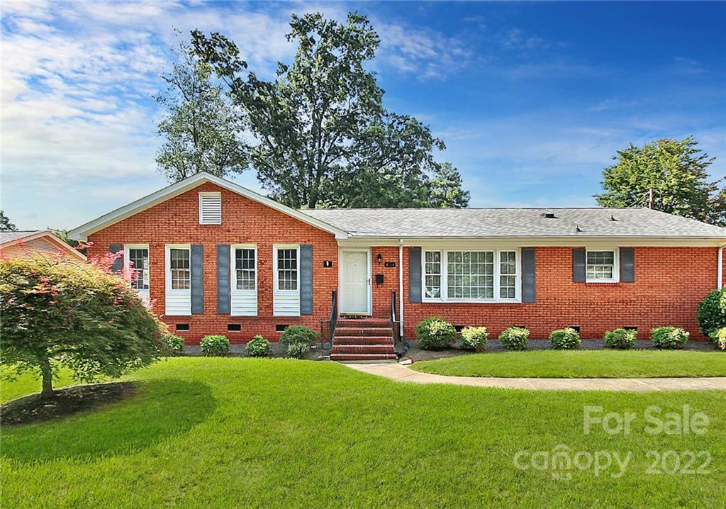 4114 Murrayhill Road Charlotte, NC 28209 - Photo 1 of 28 a front view of a house with a garden