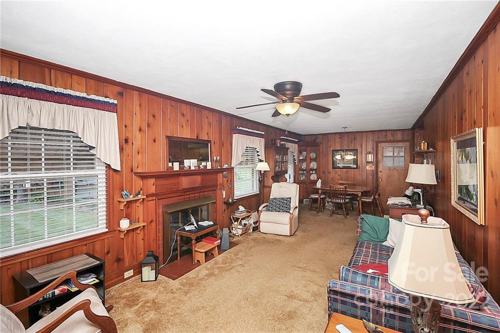 4114 Murrayhill Road Charlotte, NC 28209 - Photo 12 of 28 a living room with furniture fireplace and flat screen tv