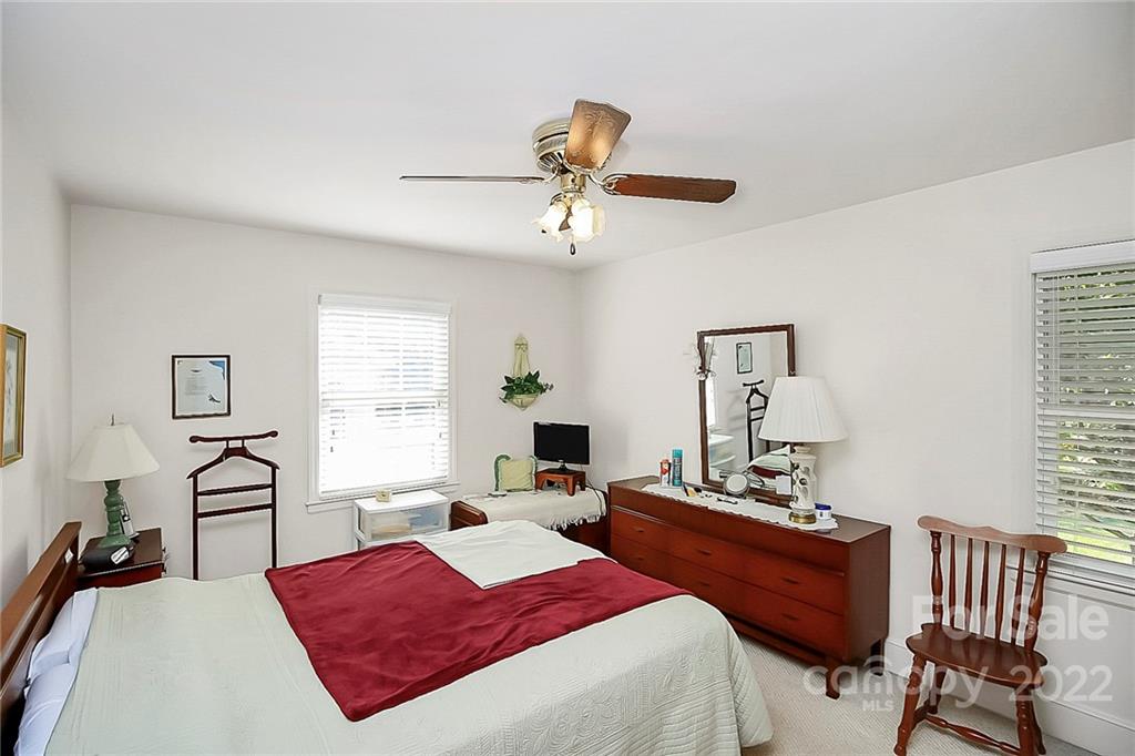 4114 Murrayhill Road Charlotte, NC 28209 - Photo 17 of 28 a bedroom with a bed furniture and window
