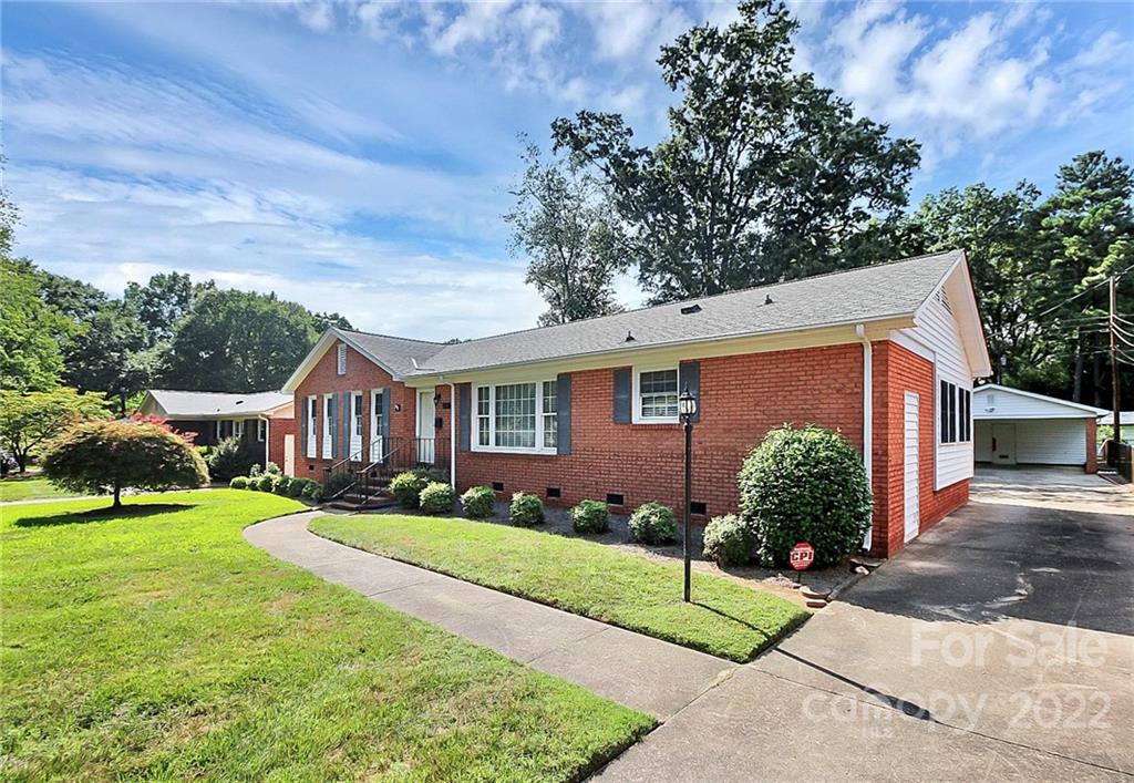 4114 Murrayhill Road Charlotte, NC 28209 - Photo 27 of 28 a front view of a house with a yard and garage