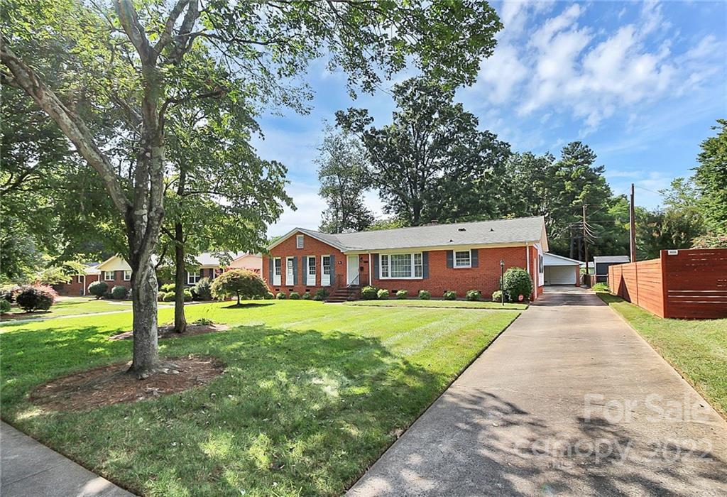 4114 Murrayhill Road Charlotte, NC 28209 - Photo 28 of 28 a front view of a house with a yard and trees