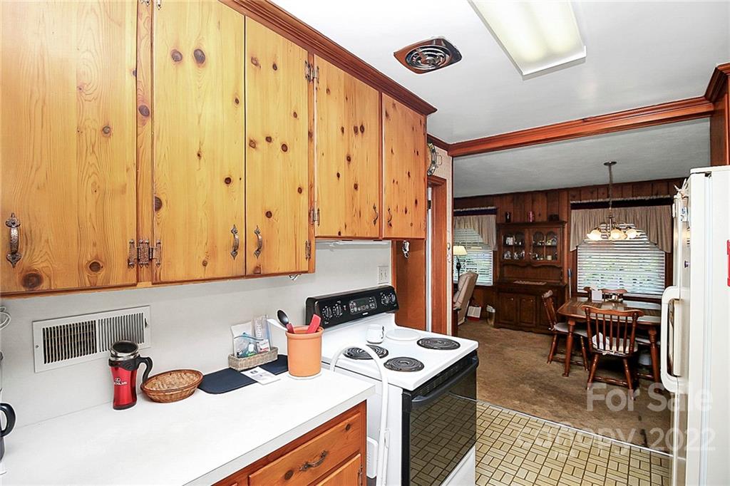 4114 Murrayhill Road Charlotte, NC 28209 - Photo 7 of 28 a kitchen with stainless steel appliances granite countertop a stove and a dining table