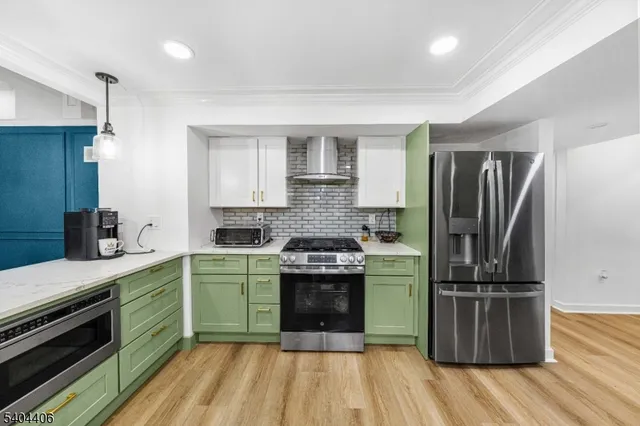 a kitchen with a sink stove and refrigerator