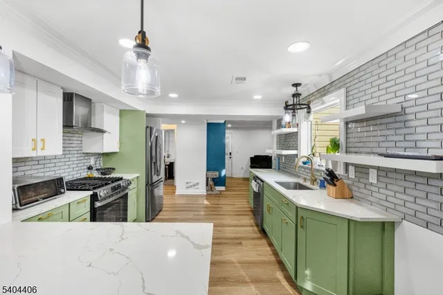 a kitchen with lots of counter top space and stainless steel appliances
