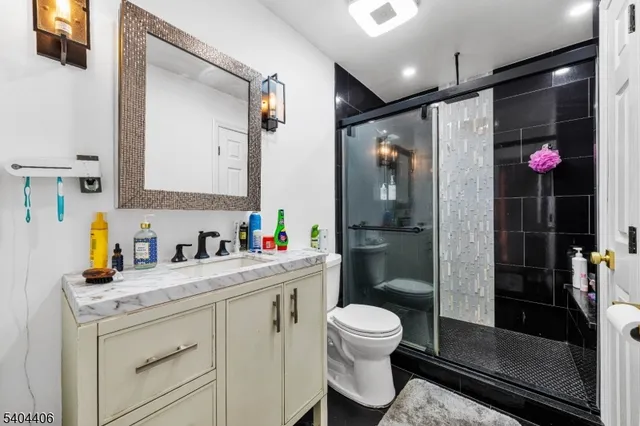 a bathroom with a toilet sink and shower