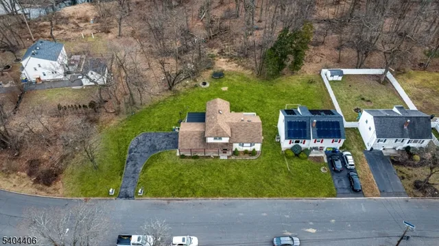 an aerial view of a house with outdoor space