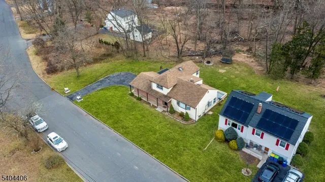 an aerial view of a house with outdoor space