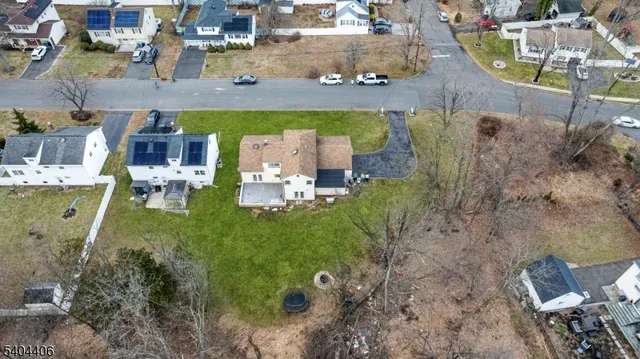 an aerial view of a house with outdoor space