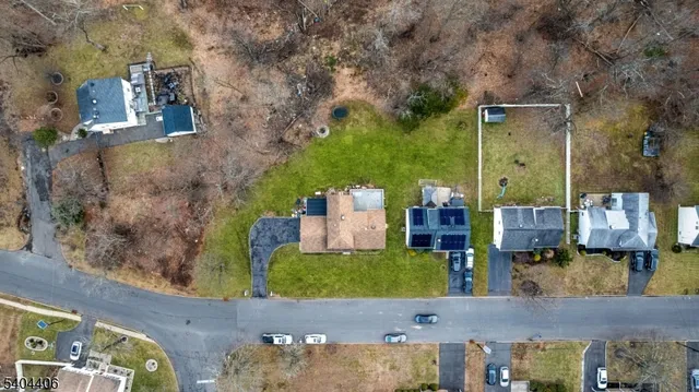 aerial view of a house with a yard
