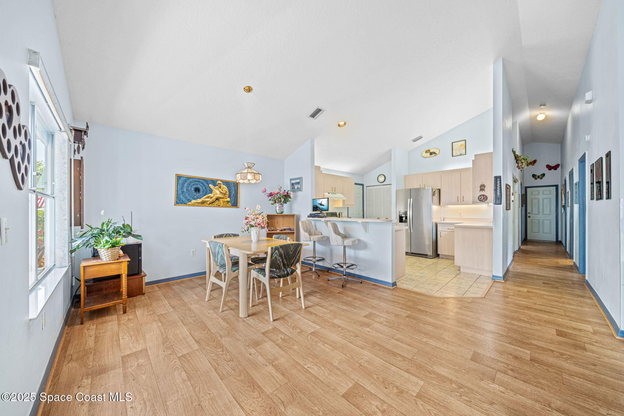 3847 Town Square Boulevard, Unit 30 Melbourne, FL 32901 - Photo 18 of 36 a living room with furniture and a wooden floor