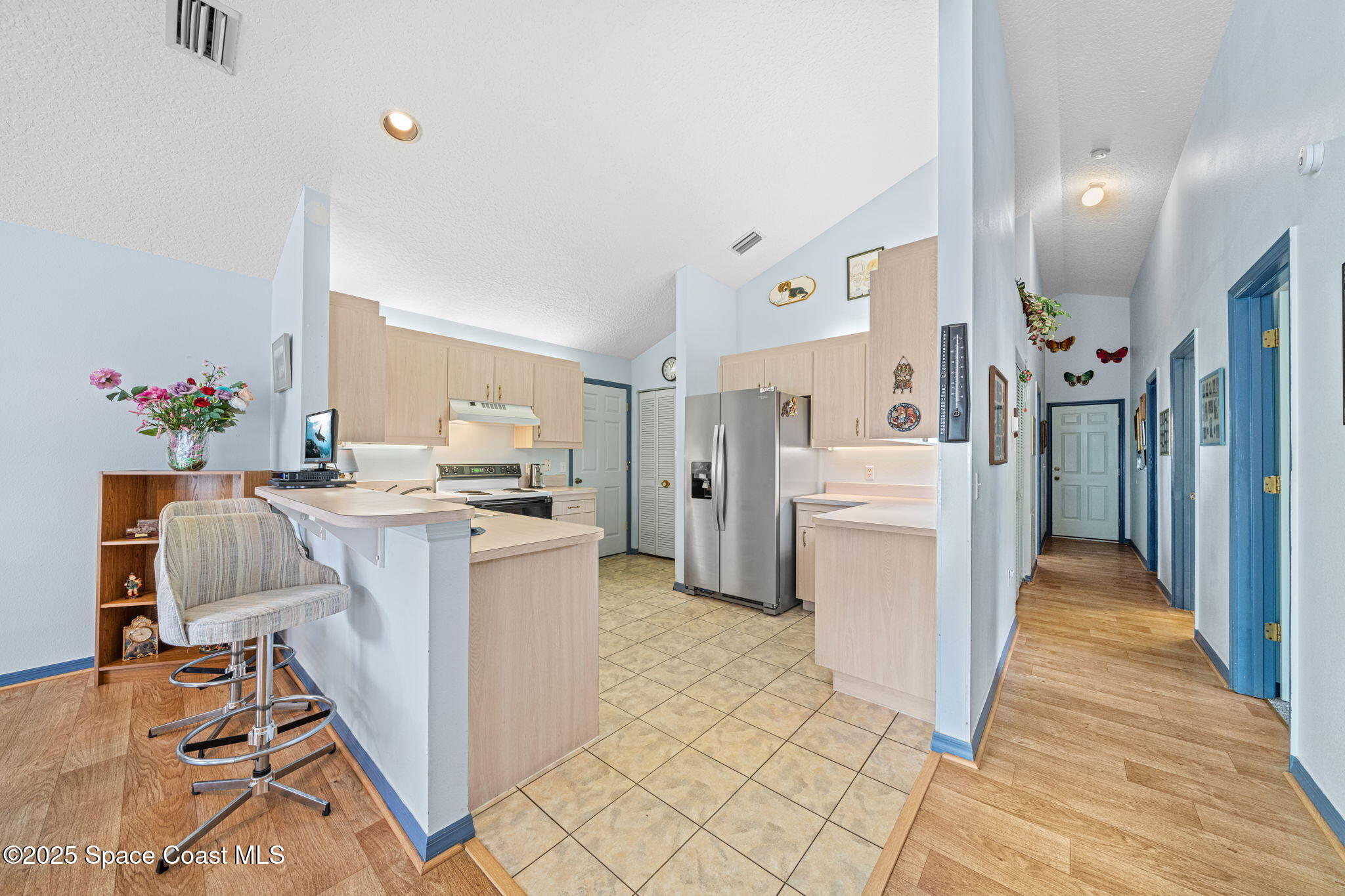 3847 Town Square Boulevard, Unit 30 Melbourne, FL 32901 - Photo 19 of 36 a living room with furniture and a wooden floor