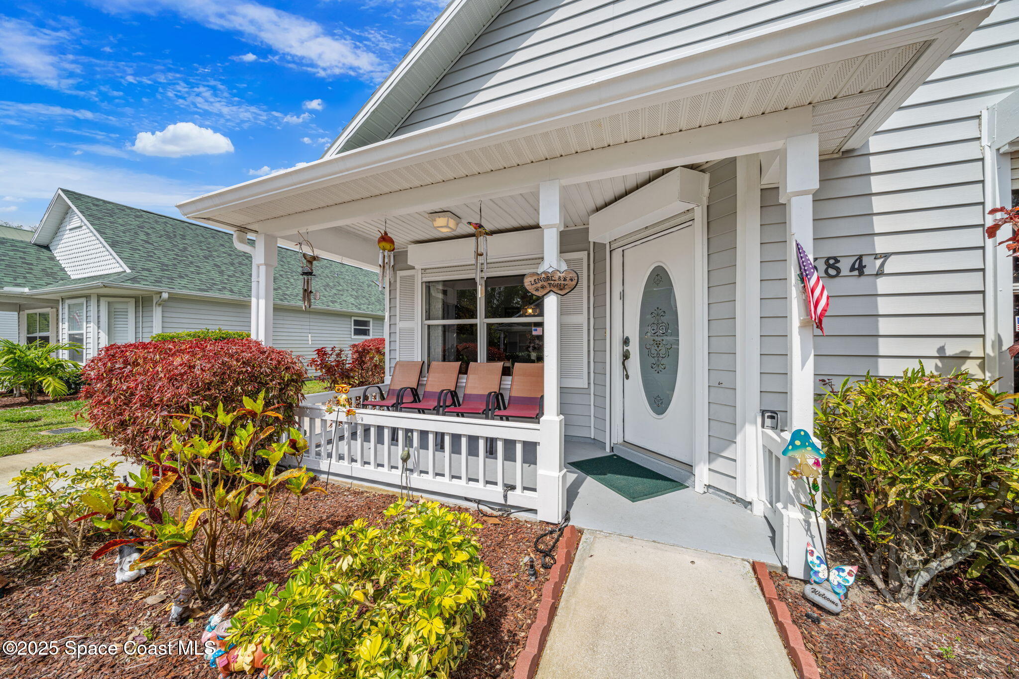 3847 Town Square Boulevard, Unit 30 Melbourne, FL 32901 - Photo 2 of 36 a front view of a house with garden