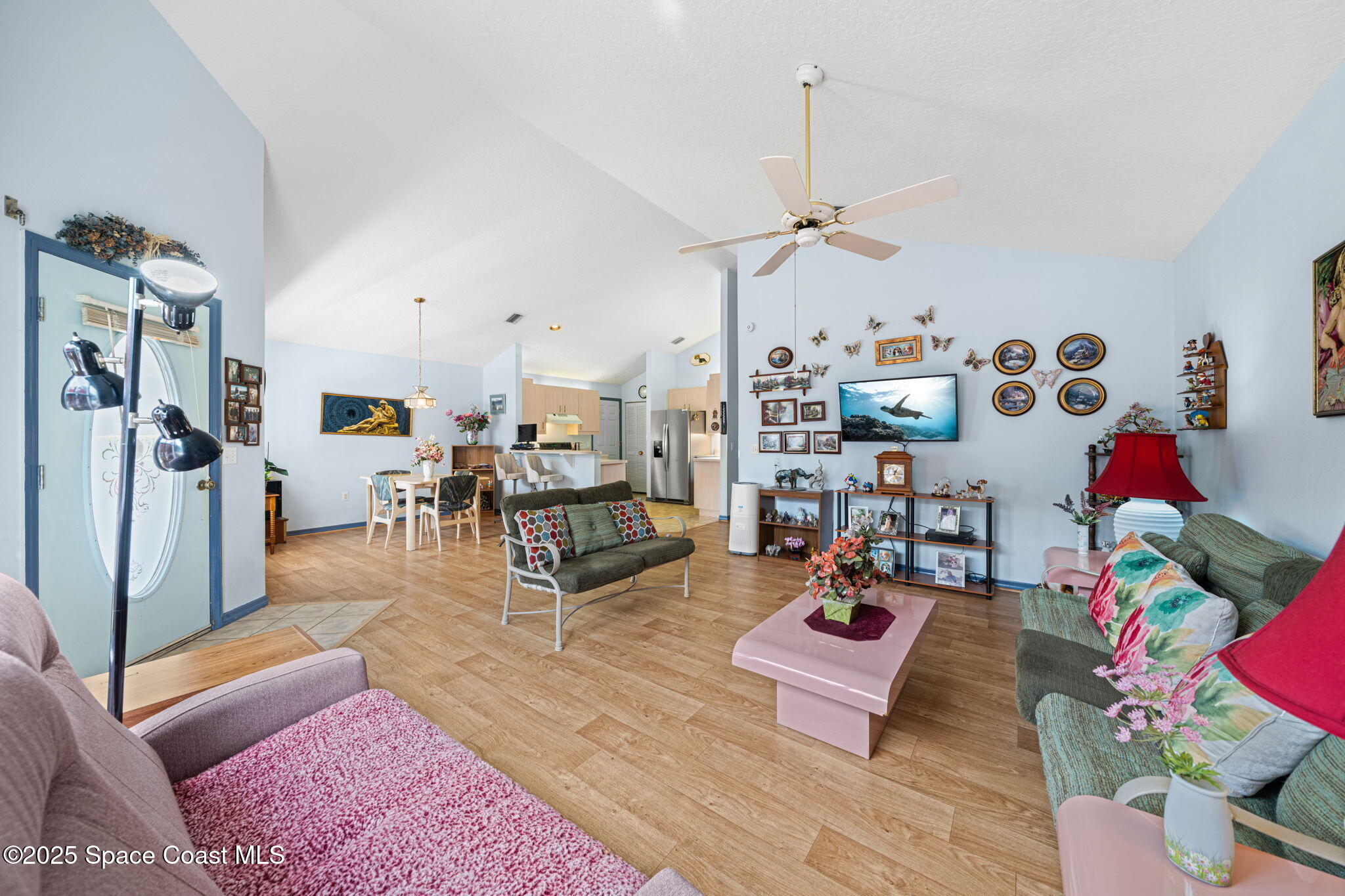 3847 Town Square Boulevard, Unit 30 Melbourne, FL 32901 - Photo 24 of 36 a living room with furniture and wooden floor