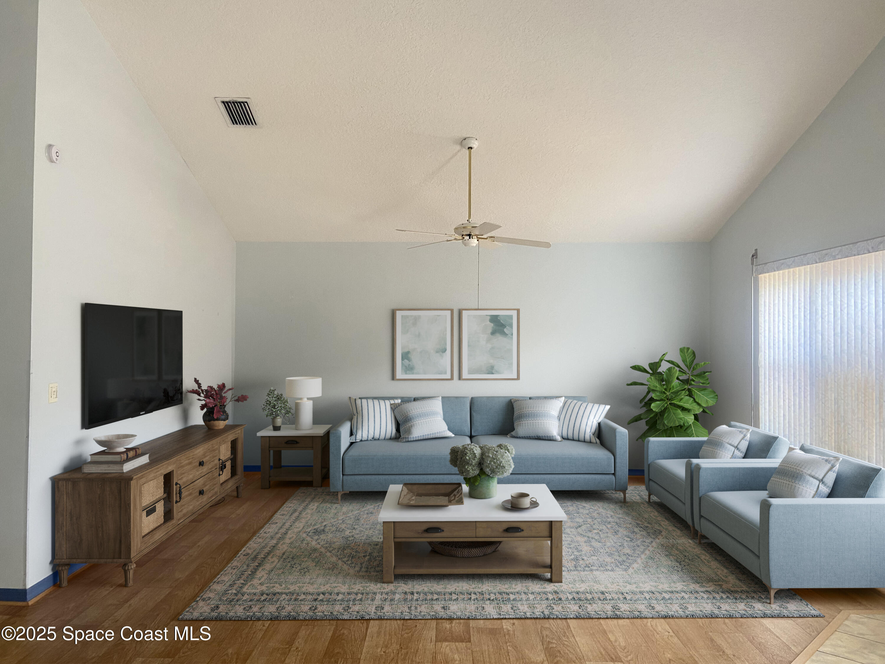 3847 Town Square Boulevard, Unit 30 Melbourne, FL 32901 - Photo 26 of 36 a living room with furniture and a flat screen tv